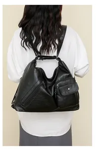 Detailed back view of a black multi-pocket large capacity faux leather backpack