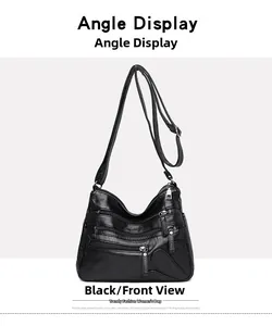 Vue de face d'un sac bandoulière vintage noir avec couture cœur et plusieurs zips
