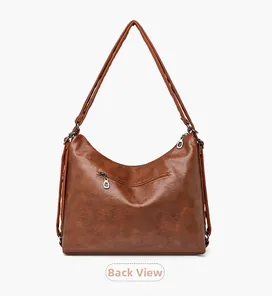 Detailed back view of dark brown leather handbag showing zipper pocket and smooth texture