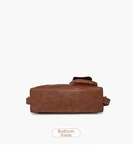 Detailed bottom view of brown vintage leather crossbody bag with premium textured finish