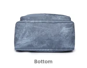 Vue détaillée du fond du sac bleu-gris montrant la texture sergé et les coutures nettes