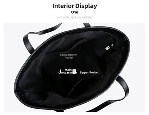 Interior view of black woven tote bag showing main compartment and zipper pocket