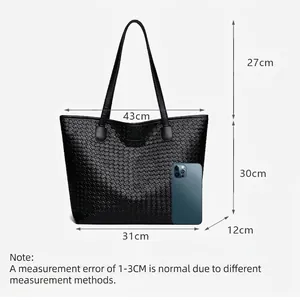 Large black woven tote bag with dimensions shown and double handles for daily commute