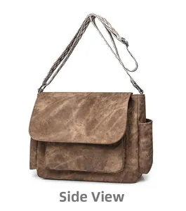Side view of large retro brown PU leather shoulder bag with geometric pattern strap