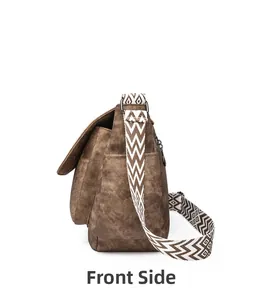 Side view of dark brown PU leather messenger bag with wide geometric pattern shoulder strap