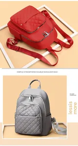 Close-up of quilted front pocket and nylon fabric on red and grey fashion backpacks