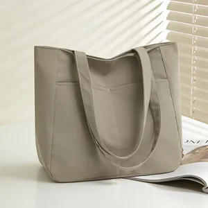 Minimalist light gray tote bag with large capacity and multi-pocket design for daily commute