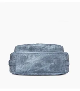 Detailed bottom view showing light blue textured leather with reinforced stitching