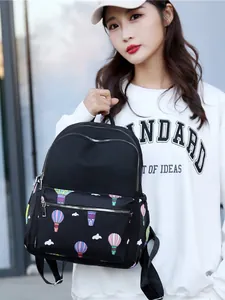 Casual black nylon backpack featuring colorful hot air balloon print and multiple pockets