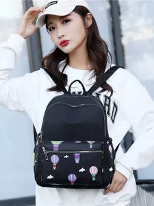 Women's black travel backpack with colorful hot air balloon print and large capacity