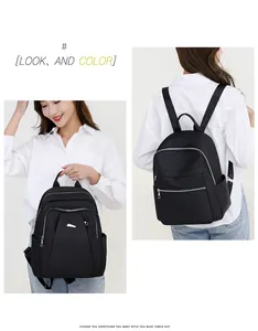 Dual view of black waterproof oxford backpack showing hand-held and back-carry style