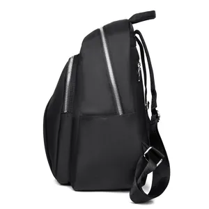 Minimalist black oxford cloth backpack with multiple zipper pockets and side compartments