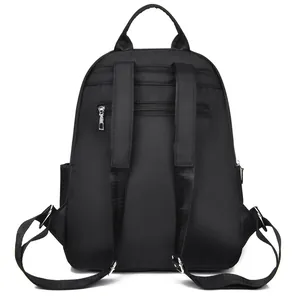 Minimalist black Oxford cloth backpack for women with anti-theft back pocket and wide straps