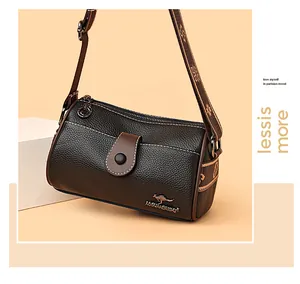 Close-up of premium leather texture and kangaroo metal logo on a crossbody bag