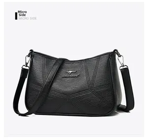 Micro side view of black leather shoulder bag with V-shaped stitching and kangaroo logo