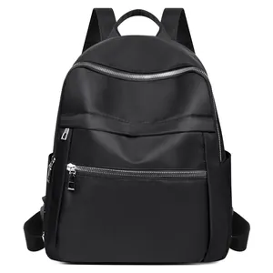 Sac à dos minimaliste en tissu Oxford noir avec poches multiples et zips argentés