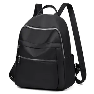 Sac à dos en tissu Oxford noir pour femmes avec doubles fermetures éclair argentées chic