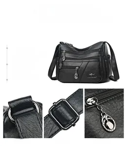 Detail showing multi-pocket design with silver-tone hardware and reinforced straps on black bag