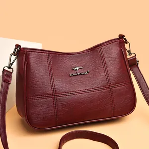 Burgundy faux leather crossbody bag with lychee texture and cross-stitch pattern