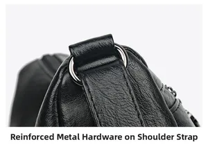 Detail of reinforced silver hardware and lychee pattern leather on black shoulder bag
