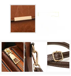 Close-up of vintage brown bag showing contrast stitching, golden hardware, and leather texture