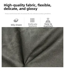Detail of high-quality dark grey fabric with fine woven texture and glossy finish