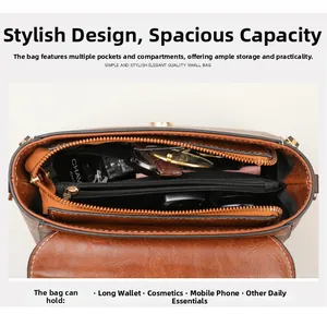 Detail view of the brown leather bag interior with multiple compartments and zipper pocket