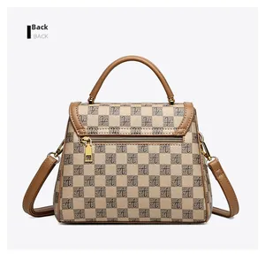 Detailed back view of a checkered handbag showing the zipper pocket and leather texture