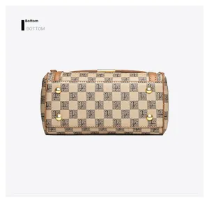 Detail view of the beige checkered handbag bottom with four protective gold metal feet