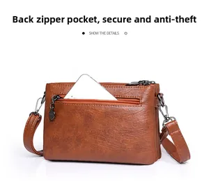 Close-up of anti-theft back zipper pocket on brown faux leather crossbody bag for phone