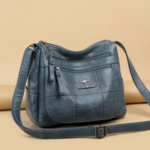 Navy blue large capacity crossbody bag with quilted lychee texture and adjustable strap