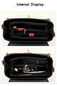 Vue intérieure d'un sac bandoulière en cuir noir avec plusieurs compartiments de rangement