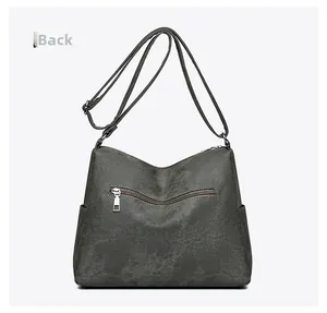 Detailed back view of a dark grey multi-layer shoulder bag with zip pocket and strap