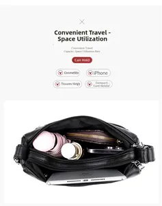 Top view of black soft leather bag showing large capacity with multi-layer compartments