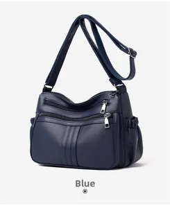 Vista dettagliata della borsa a tracolla in pelle PU blu con tasche multiple a zip