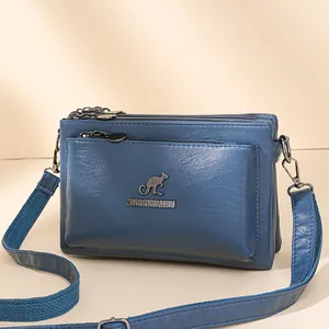 Bolso bandolera azul multicapa de cuero PU con logo de canguro y correa ajustable