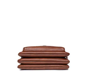 Detail of a brown lychee pattern leather handbag featuring a four-layer accordion structure