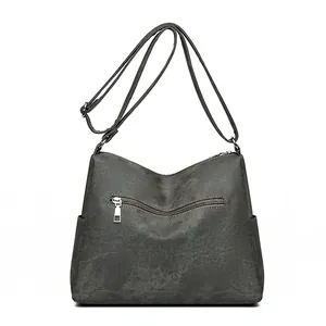 Deep grey multi-layer crossbody bag with adjustable strap and silver hardware