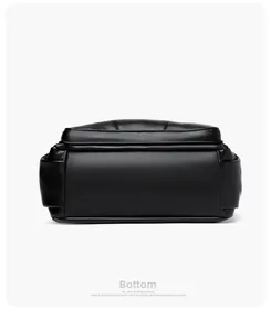 Detailed bottom view of black pebble leather crossbody bag with reinforced stitching