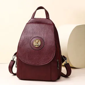 Eleganter weinroter PU-Lederrucksack mit Goldemblem und Lychee-Struktur für Damen