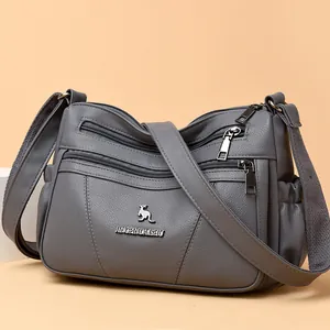 Grey minimalist multi-zipper crossbody bag with litchi texture and adjustable strap