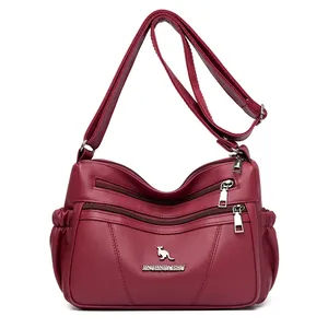 Burgundy litchi grain faux leather crossbody bag with multiple zip pockets and kangaroo logo