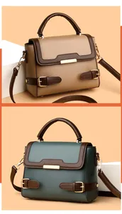Detail of contrast color crossbody bags with pebbled leather texture and metal buckles
