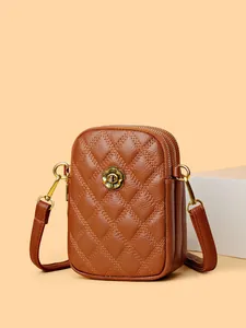 Sacoche bandoulière en cuir matelassé marron avec boucle florale et double zip