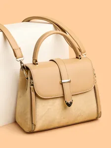 Elegant beige woven texture crossbody bag with heart buckle and adjustable shoulder strap