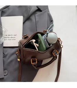 Interior view showing the large capacity of the brown Boston bag for daily essentials