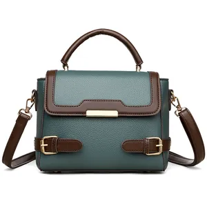 Large dark green and brown leather tote bag with gold hardware and shoulder strap
