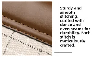 Detail of brown litchi leather texture with precise stitching and checkered fabric lining
