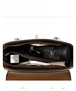 Overhead view showing organized compartments and internal storage of the vintage plaid bag