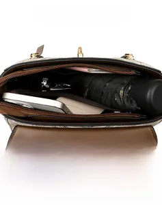 Macro view of the spacious inner compartments of this stylish beige crossbody bag